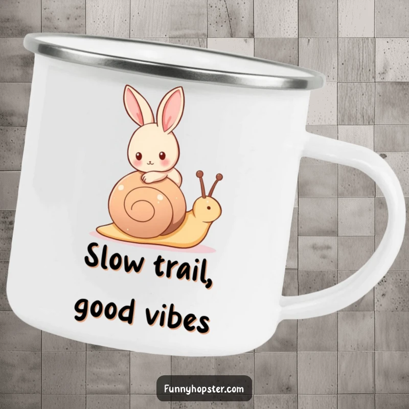 Funny camping mug showing a tiny rabbit happily riding on the back of a friendly, slow-moving snail in nature.