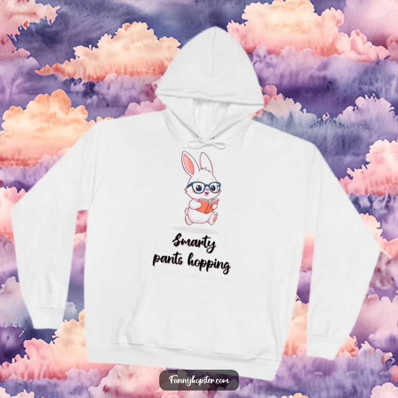 Funny hoodie depicting a fluffy rabbit with tiny glasses, excitedly hopping with a book, radiating studious and cheerful vibes.