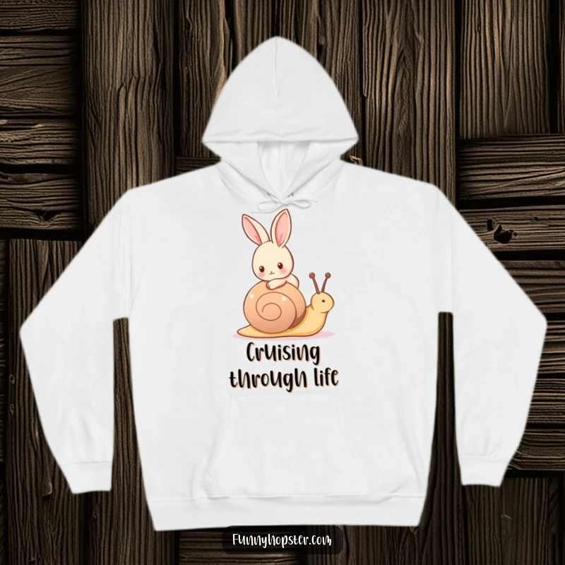 Funny hoodie of a tiny rabbit peacefully riding on the back of a friendly snail, enjoying a leisurely journey.