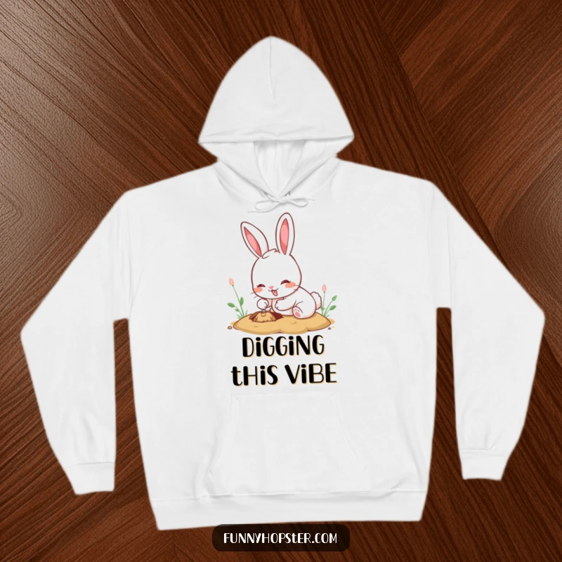 Funny kawaii rabbit hoodie showcasing a cute bunny intensely digging a large hole with a happy, satisfied expression.