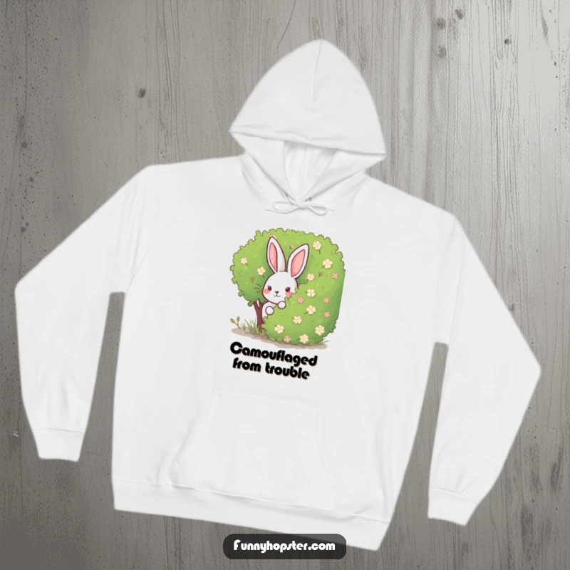 Funny Rabbit Hoodie: A comfortable hoodie with a rabbit peeking from behind a bush, symbolizing playful concealment and cozy fun.