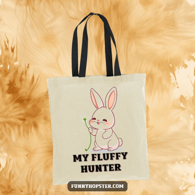 Funny tote bag featuring a rabbit character playfully batting at a floating dandelion seed, bringing joy.